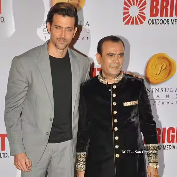 Yogesh Lakhani with Hrithik Roshan in front of a Bright Outdoor Media backdrop